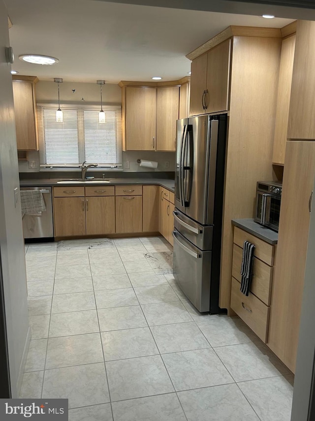 115 Carnoustie Rd, Dover, DE 19904 - kitchen with a sink, a toaster, pendant lighting, dark countertops, and appliances with stainless steel finishes