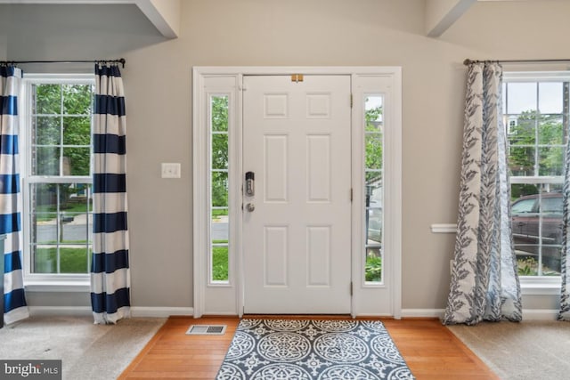 8645 Adrienne Pl, Manassas, VA 20110 - entrance foyer with baseboards and wood finished floors