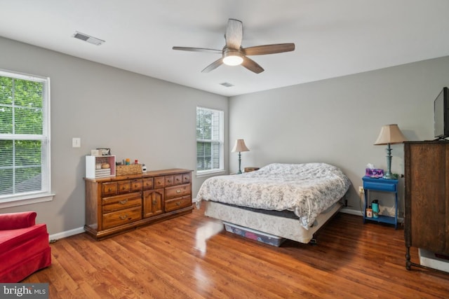 8645 Adrienne Pl, Manassas, VA 20110 - bedroom with wood finished floors, baseboards, and ceiling fan