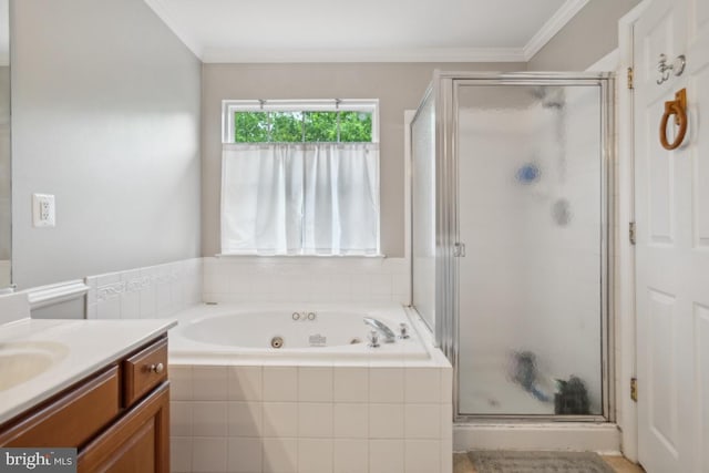 8645 Adrienne Pl, Manassas, VA 20110 - bathroom featuring vanity, a shower stall, a jetted tub, and crown molding
