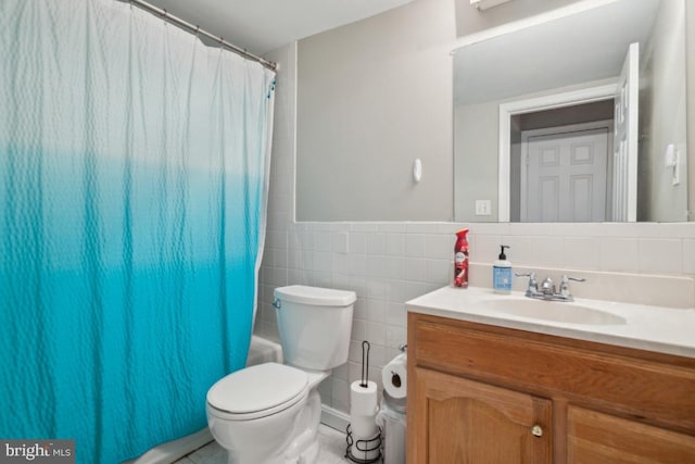 8645 Adrienne Pl, Manassas, VA 20110 - bathroom featuring vanity, toilet, and tile walls