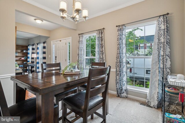 8645 Adrienne Pl, Manassas, VA 20110 - carpeted dining area with a chandelier, baseboards, and ornamental molding