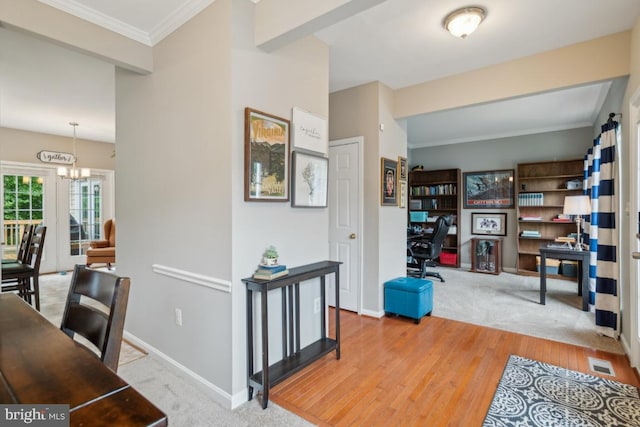 8645 Adrienne Pl, Manassas, VA 20110 - home office featuring wood finished floors, a chandelier, baseboards, and ornamental molding