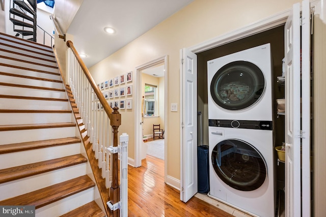 866 N 20th St, Philadelphia, PA 19130 - washroom featuring stacked washer and clothes dryer, light wood-style floors, recessed lighting, and baseboards