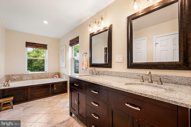 866 N 20th St, Philadelphia, PA 19130 - bathroom with a bath, double vanity, and tile patterned floors
