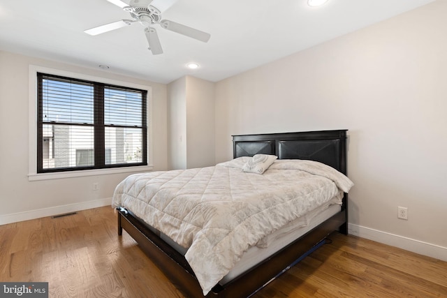 bedroom featuring wood finished floors, visible vents, baseboards, ceiling fan, and recessed lighting