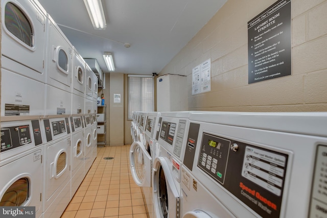 1 E University Pkwy Unit 1502, Baltimore, MD 21218 - community laundry room featuring separate washer and dryer, stacked washing maching and dryer, and light tile patterned floors