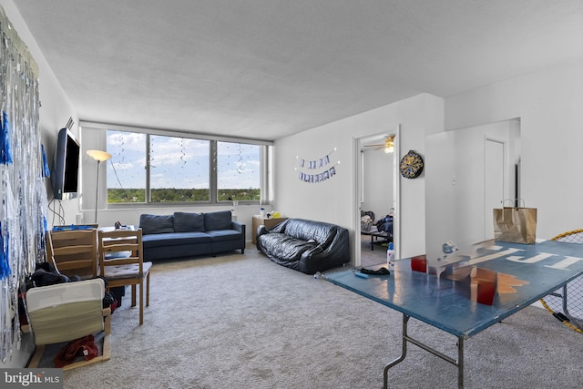 1 E University Pkwy Unit 1502, Baltimore, MD 21218 - living room with carpet flooring and ceiling fan