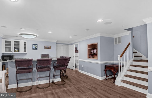 760 Whitetail Cir, King Of Prussia, PA 19406 - bar featuring black microwave, stairway, wood finished floors, crown molding, and baseboards