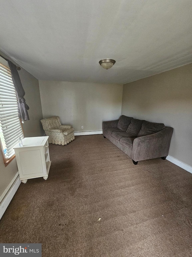 519 Furnace St, Cumberland, MD 21502 - unfurnished living room featuring dark carpet, baseboards, and a baseboard heating unit