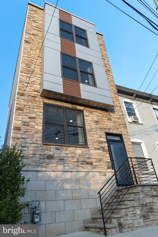 view of front of house with stone siding