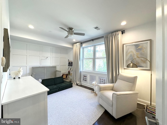 living area with a ceiling fan and recessed lighting