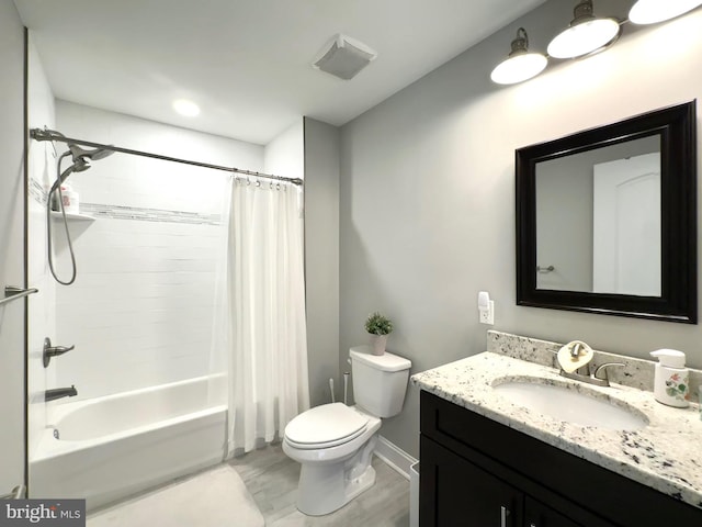 full bathroom featuring toilet, vanity, shower / tub combo with curtain, wood finished floors, and baseboards