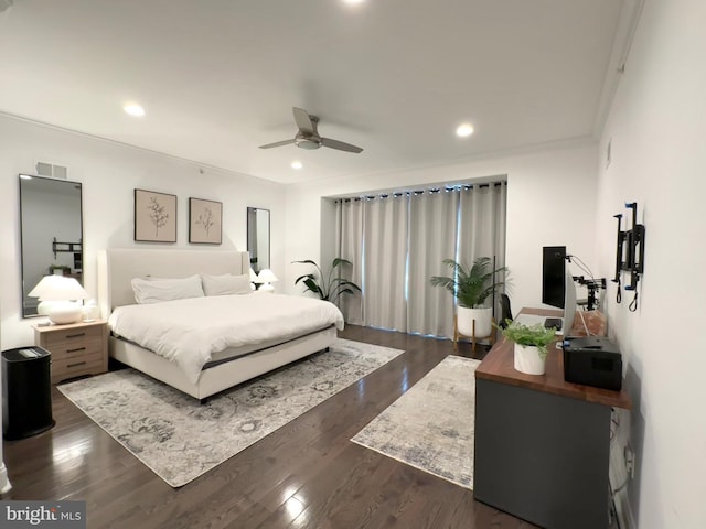 bedroom featuring recessed lighting, dark wood-style floors, a ceiling fan, and crown molding