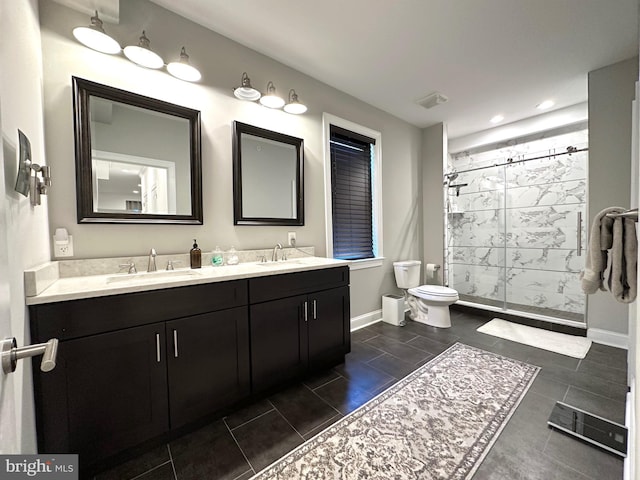 full bathroom featuring a stall shower, baseboards, toilet, double vanity, and recessed lighting