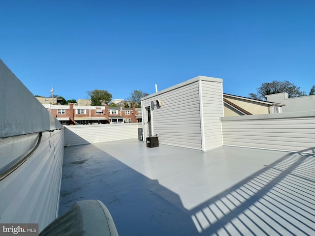 view of side of property featuring fence