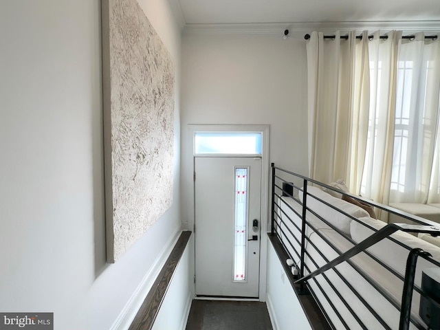 entryway featuring ornamental molding