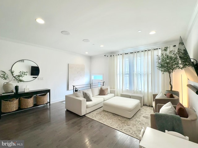 living area with ornamental molding, wood finished floors, and recessed lighting