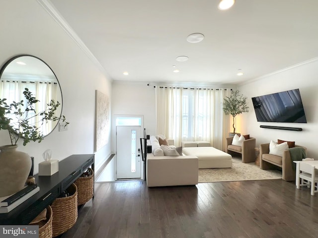 living room with crown molding, wood-type flooring, and recessed lighting