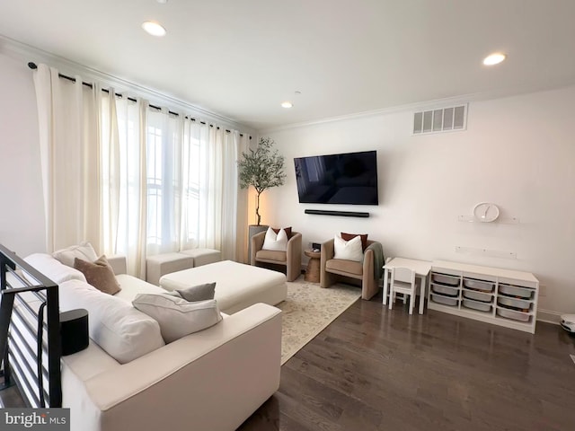living room with recessed lighting, dark wood-style flooring, and ornamental molding