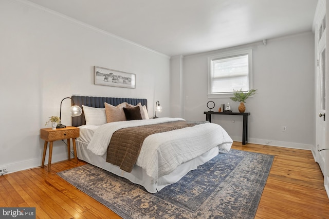 240 W Philadelphia St, York, PA 17403 - bedroom featuring crown molding, baseboards, and wood finished floors