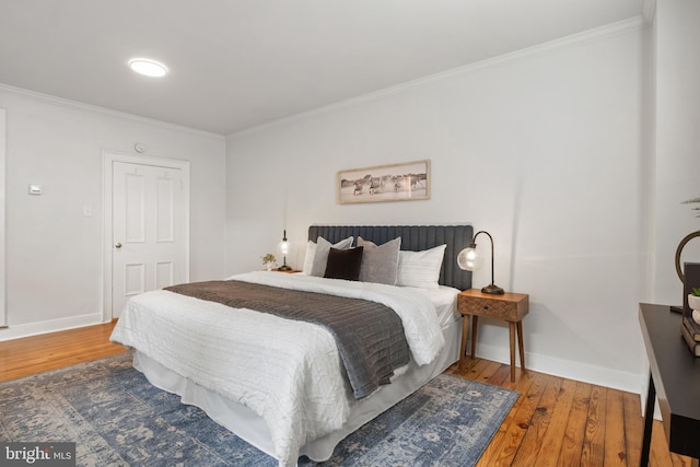 240 W Philadelphia St, York, PA 17403 - bedroom featuring baseboards, ornamental molding, and wood-type flooring