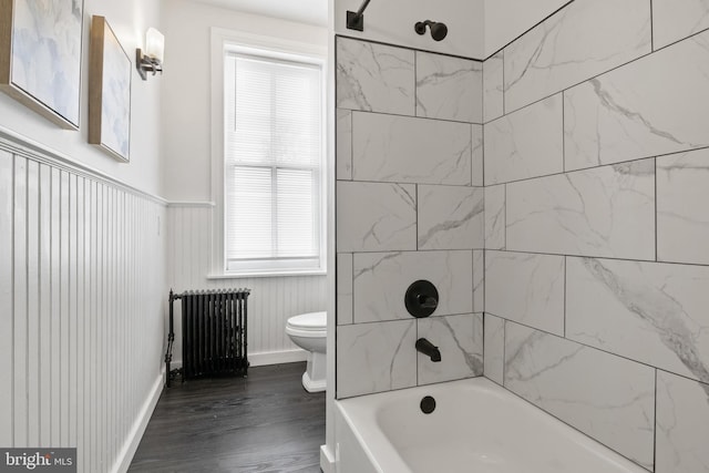 240 W Philadelphia St, York, PA 17403 - full bath featuring toilet, wood finished floors, radiator heating unit, baseboards, and bathtub / shower combination
