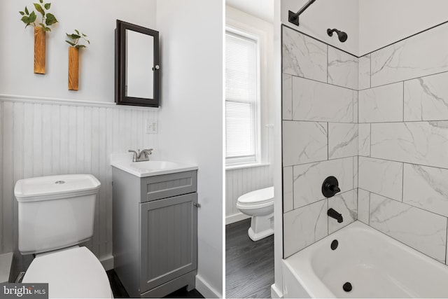 240 W Philadelphia St, York, PA 17403 - full bathroom with toilet, wood finished floors, washtub / shower combination, wainscoting, and vanity