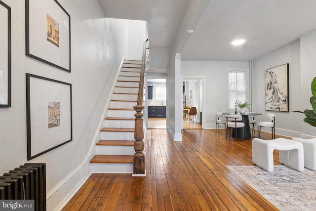 240 W Philadelphia St, York, PA 17403 - stairs with baseboards, radiator heating unit, and hardwood / wood-style flooring