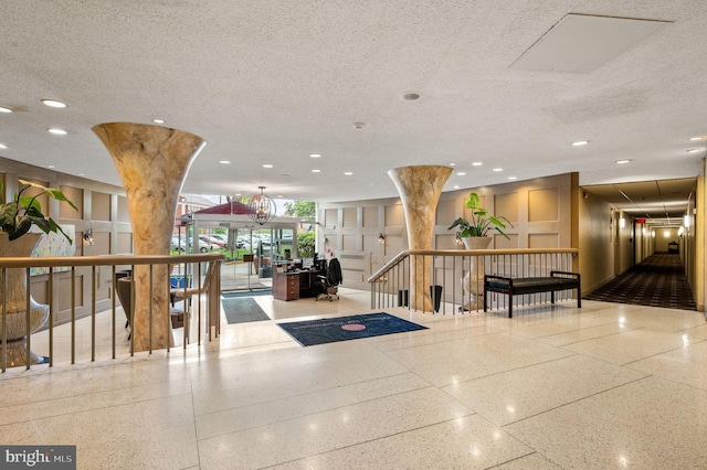 common area with recessed lighting and a textured ceiling