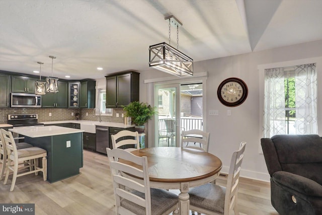 172 Charles St, Hanover, PA 17331 - dining room with healthy amount of natural light, light wood-style flooring, baseboards, a chandelier, and recessed lighting