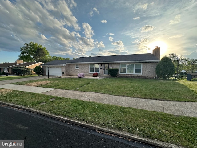 414 Susan Rd, Harrisburg, PA 17109 - ranch-style home featuring brick siding, driveway, an attached garage, a front lawn, and a chimney