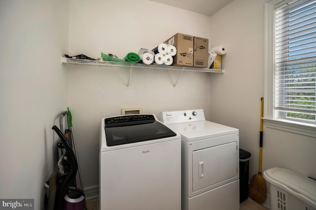 clothes washing area featuring independent washer and dryer