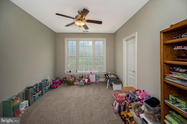 rec room with ceiling fan and carpet floors