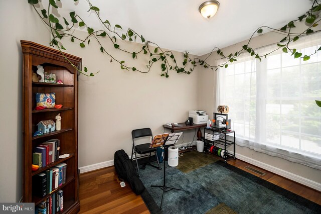 office featuring baseboards and wood finished floors