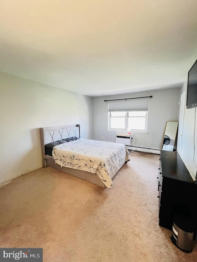 bedroom featuring baseboard heating and carpet