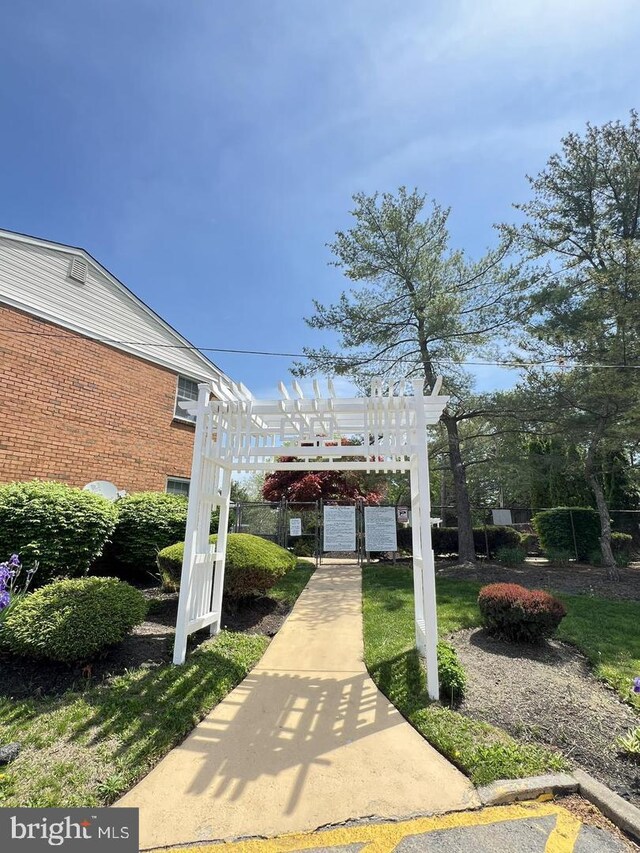 view of property's community featuring a pergola