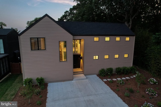 19690 Dunbar St, Rehoboth Beach, DE 19971 - modern farmhouse with a patio and roof with shingles