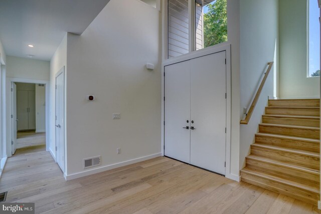 19690 Dunbar St, Rehoboth Beach, DE 19971 - entryway featuring light wood finished floors, stairs, healthy amount of natural light, and recessed lighting