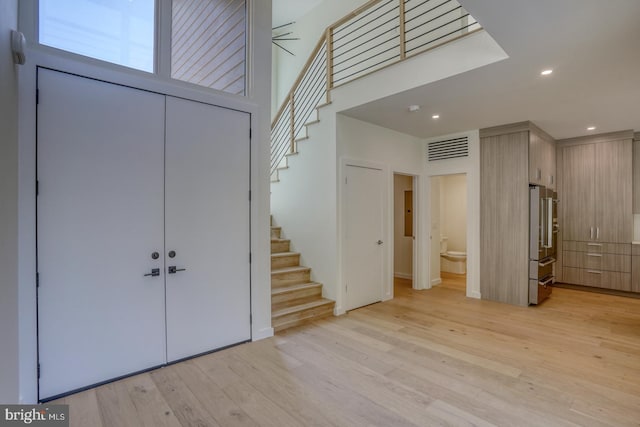 19690 Dunbar St, Rehoboth Beach, DE 19971 - foyer entrance with stairs, light wood-style flooring, and recessed lighting