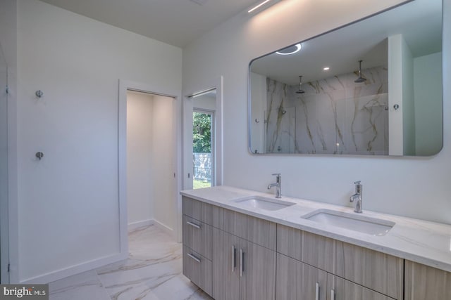 19690 Dunbar St, Rehoboth Beach, DE 19971 - bathroom featuring marble finish flooring, double vanity, and a marble finish shower