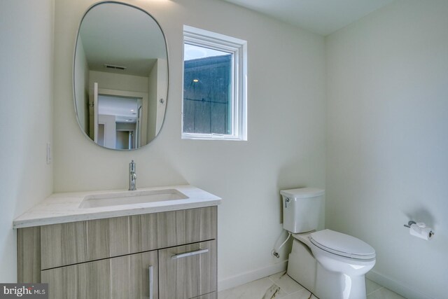19690 Dunbar St, Rehoboth Beach, DE 19971 - half bathroom featuring vanity and toilet