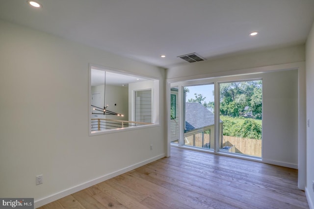 19690 Dunbar St, Rehoboth Beach, DE 19971 - empty room with recessed lighting and wood finished floors