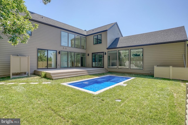 19690 Dunbar St, Rehoboth Beach, DE 19971 - back of property featuring a deck, an outdoor pool, a yard, and a shingled roof