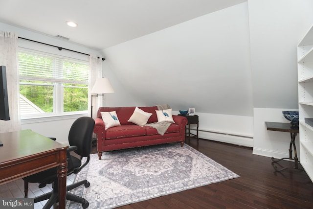 office space featuring hardwood / wood-style flooring, lofted ceiling, visible vents, a baseboard radiator, and baseboards