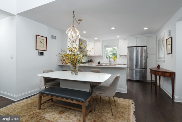 dining space with visible vents, dark wood-style flooring, baseboards, a chandelier, and recessed lighting