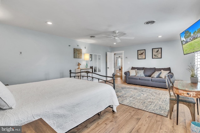 bedroom with a ceiling fan, visible vents, recessed lighting, and wood finished floors