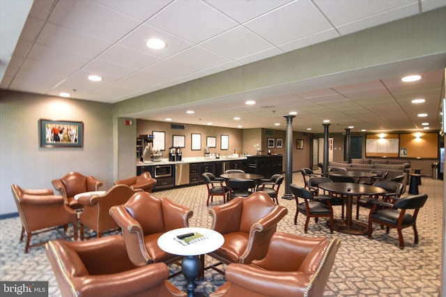 community lobby featuring a drop ceiling and recessed lighting