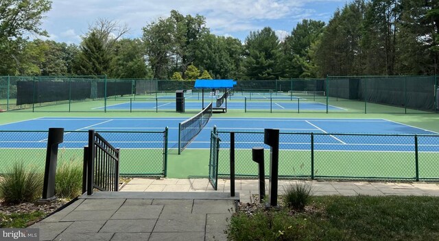 view of tennis court with fence
