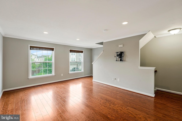 25187 Hummocky Ter, Aldie, VA 20105 - empty room featuring crown molding, baseboards, wood finished floors, and recessed lighting